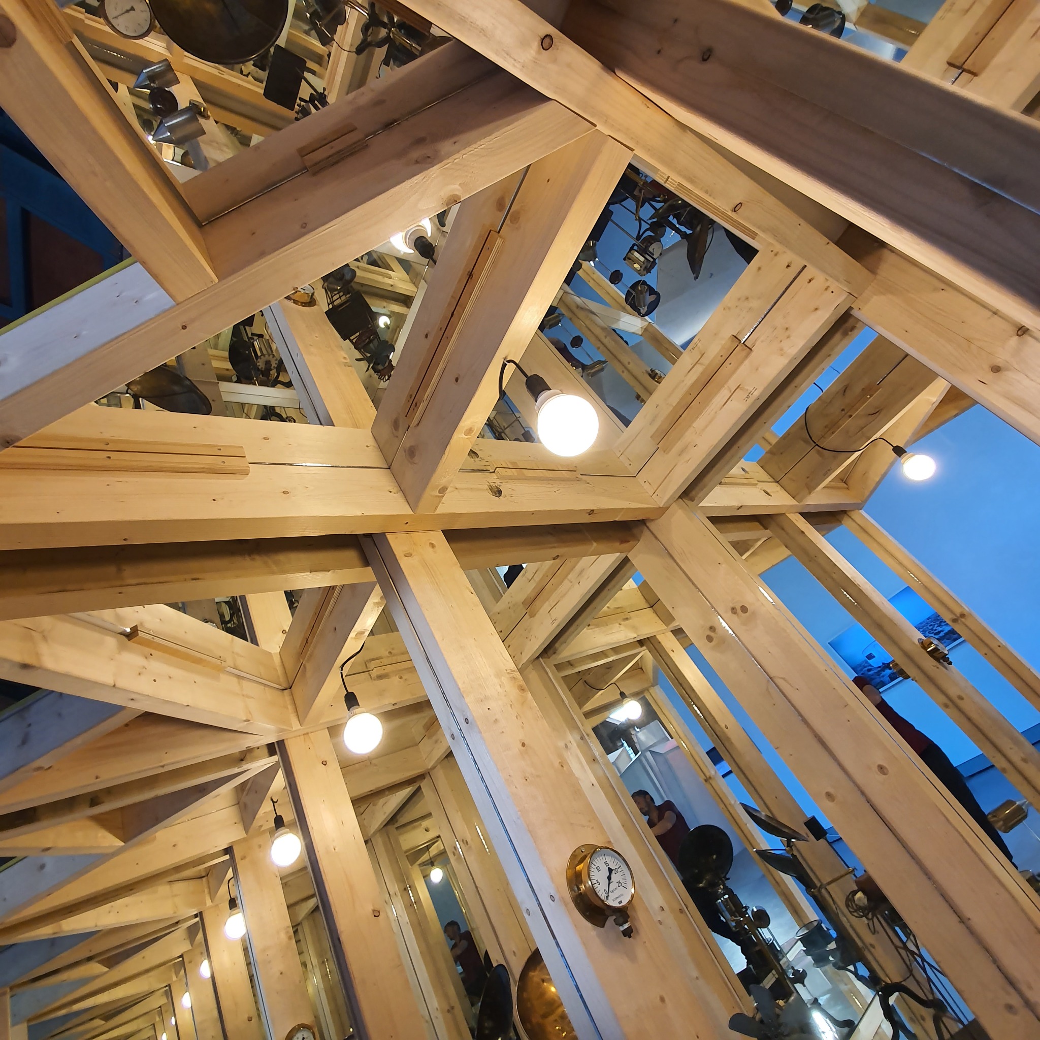 Mirrored timber structure seen from below