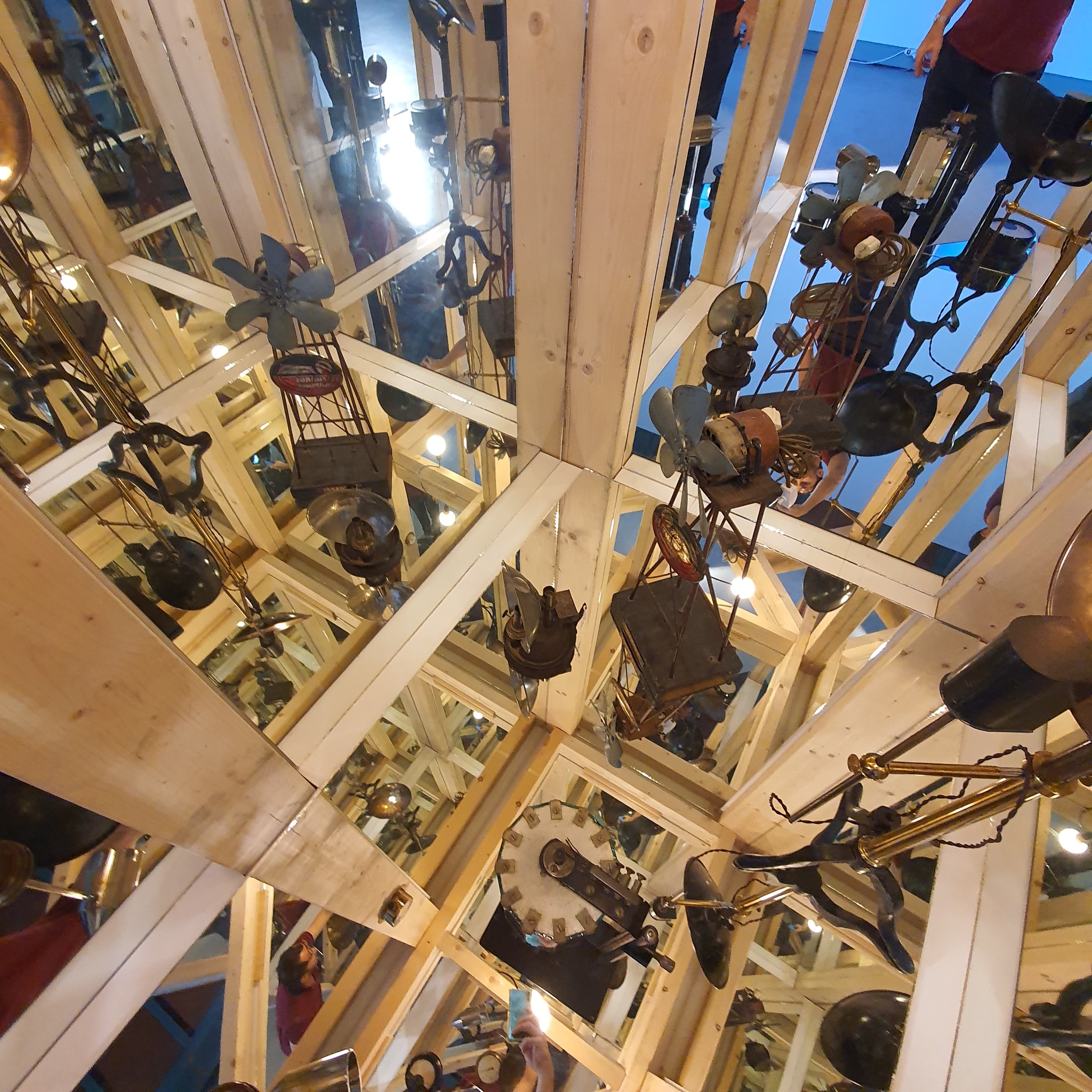Objects reflected through the timber installation