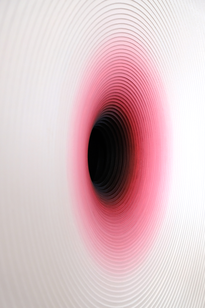 Angled view into the red concentric relief