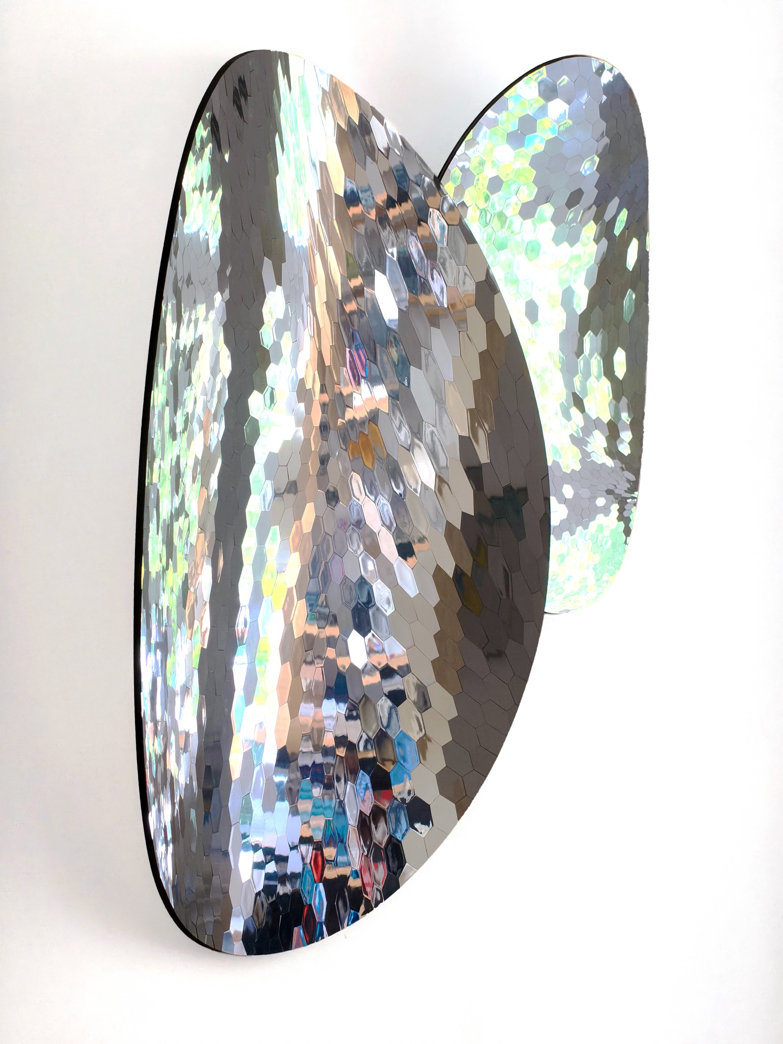 Two curved hexagon mirrors seen together
