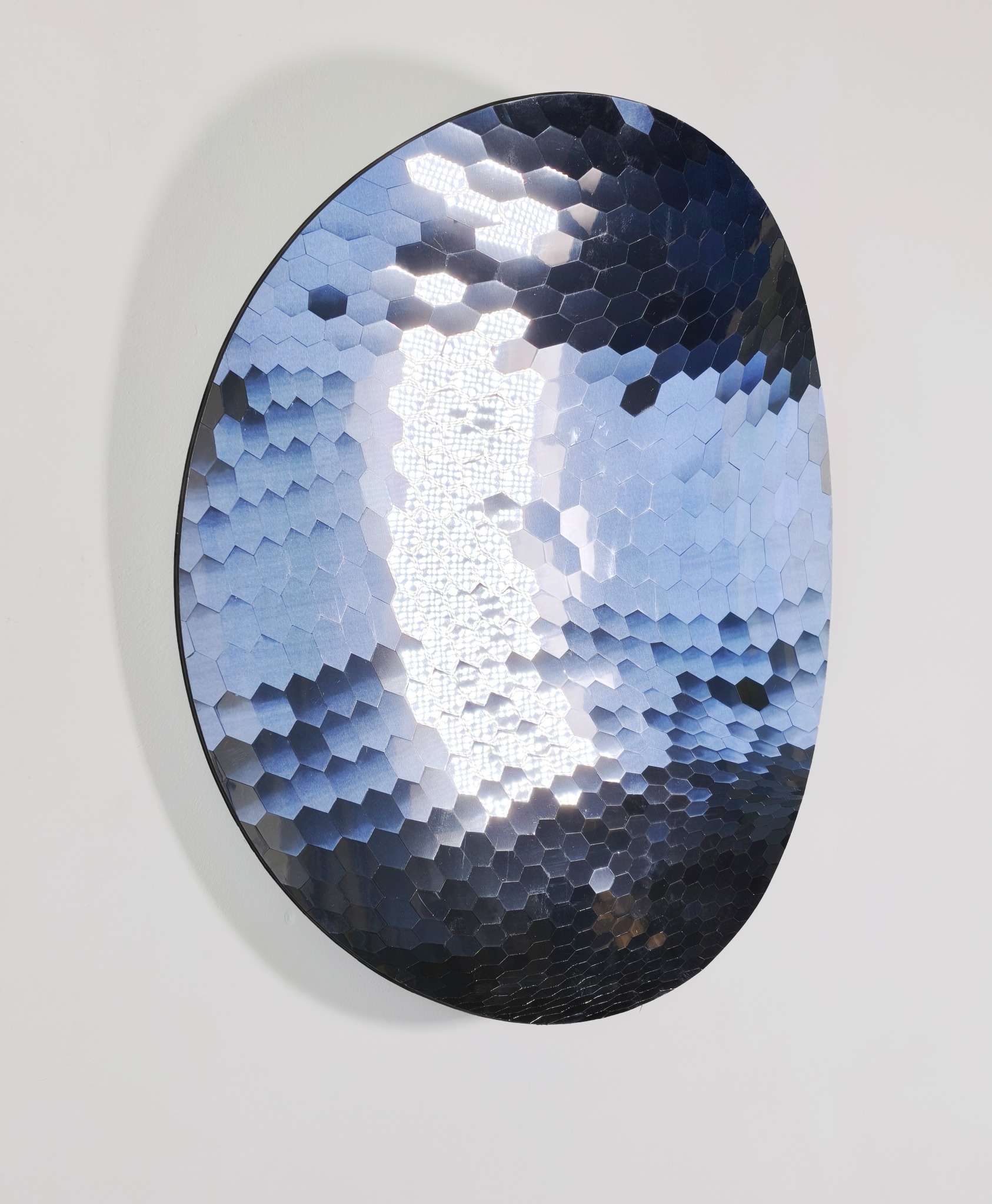 Close view of the mirror's hexagonal facets