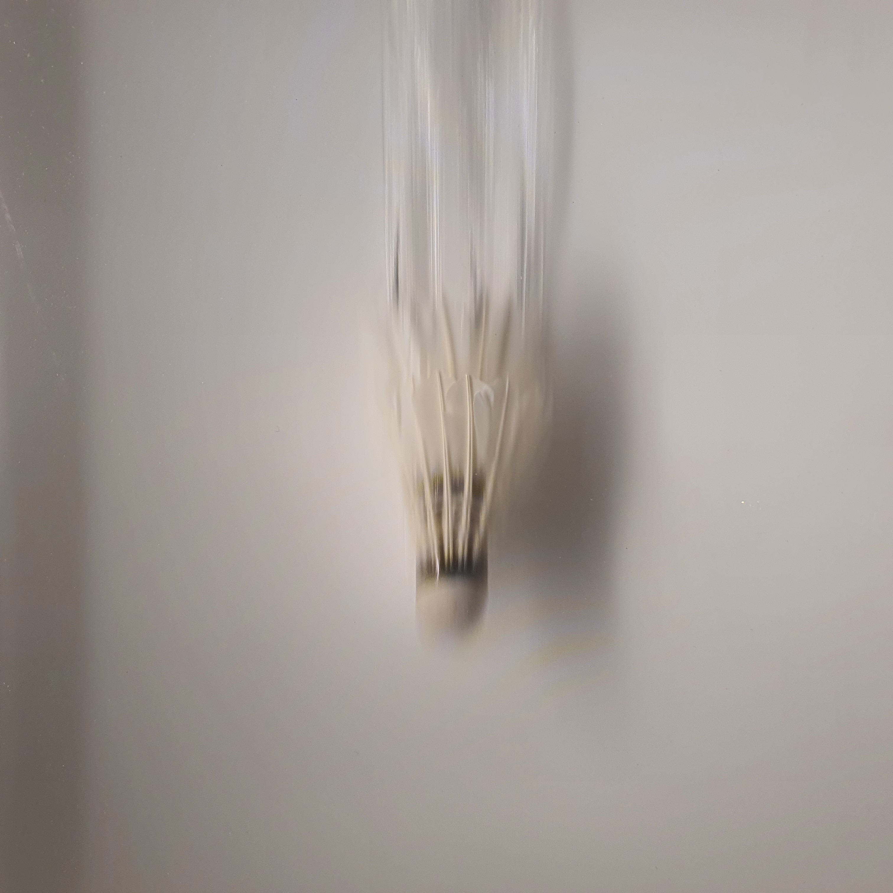 Badminton shuttle blurred in motion
