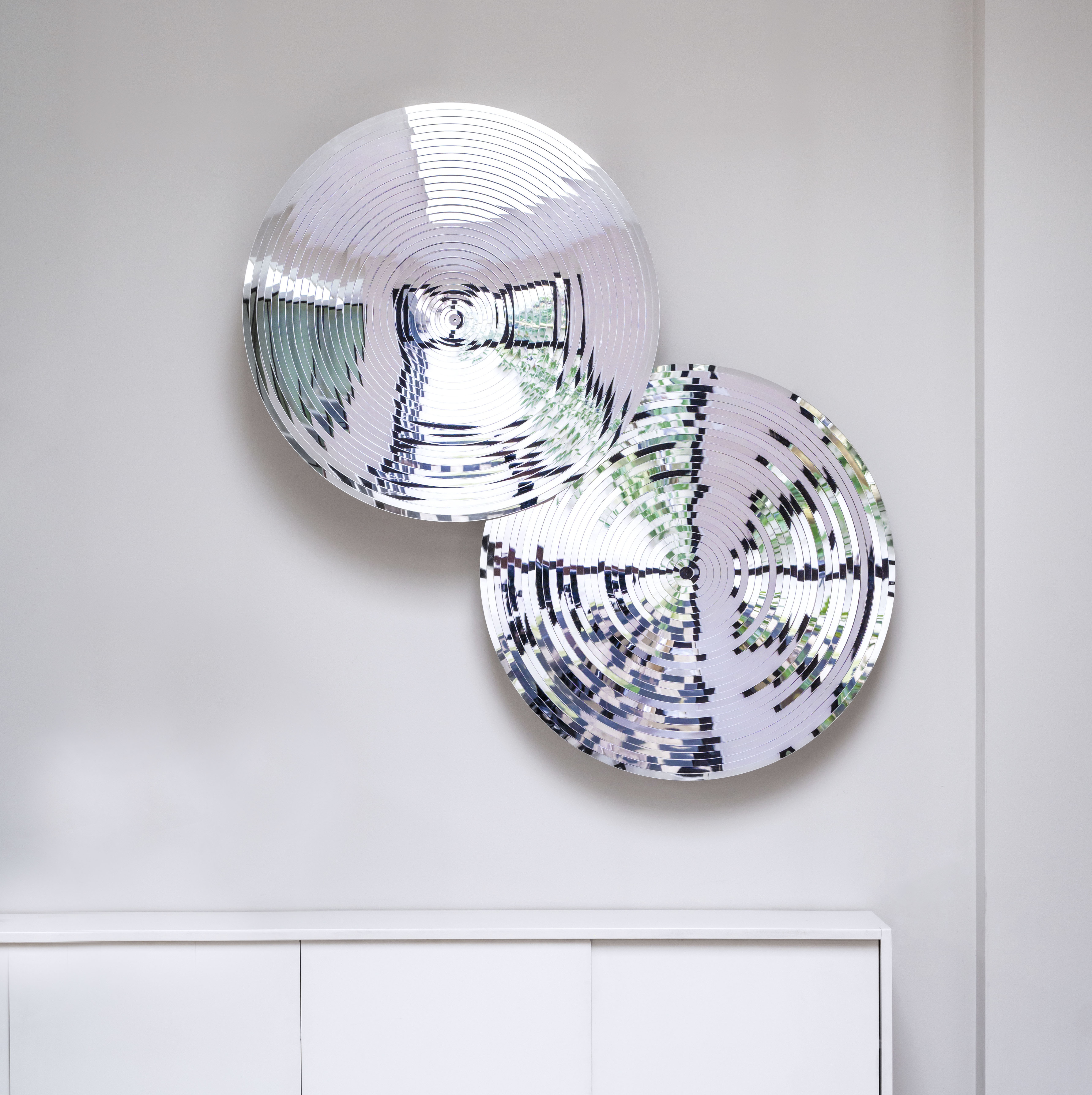 Pair of concentric mirrored works