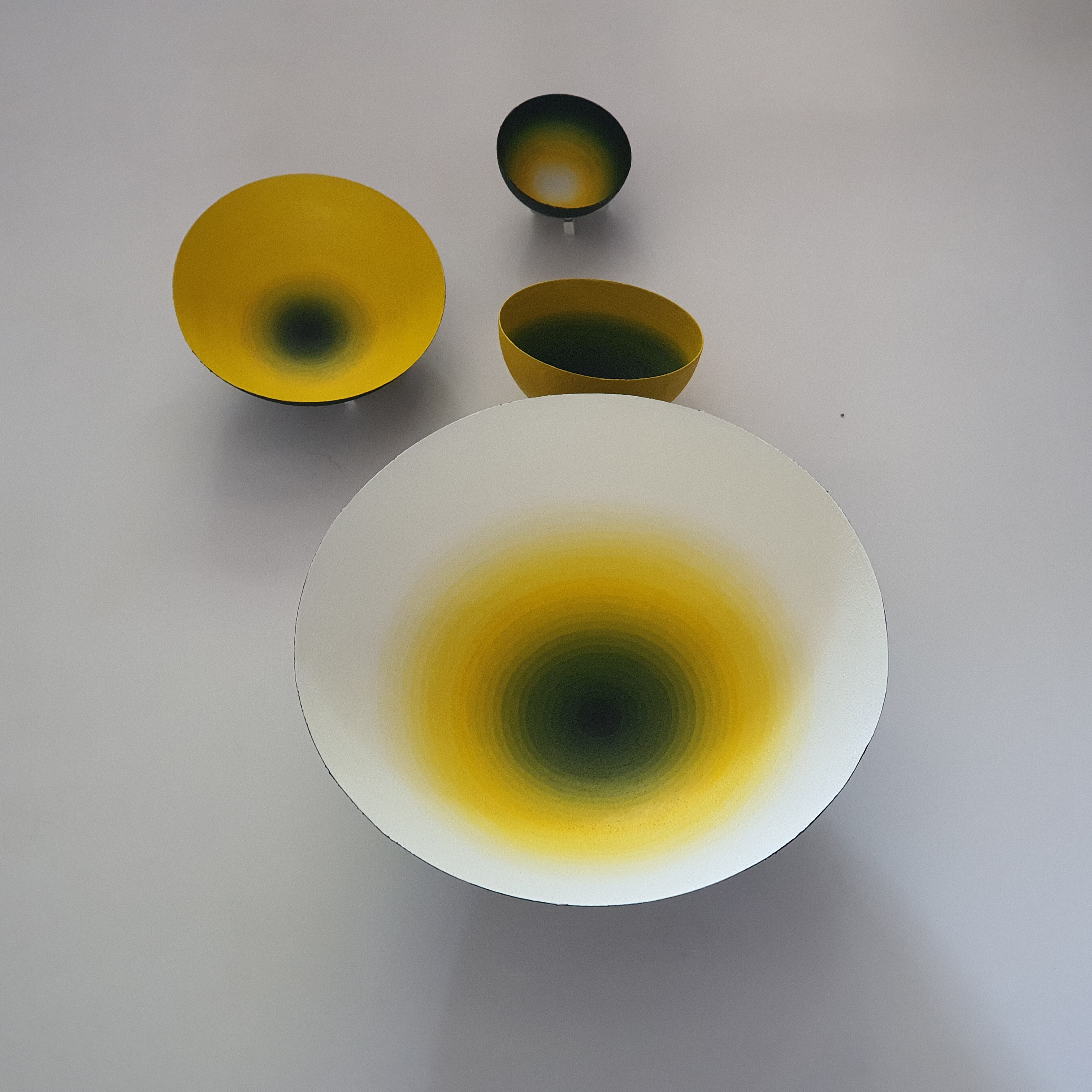 Second view of yellow to black shell works