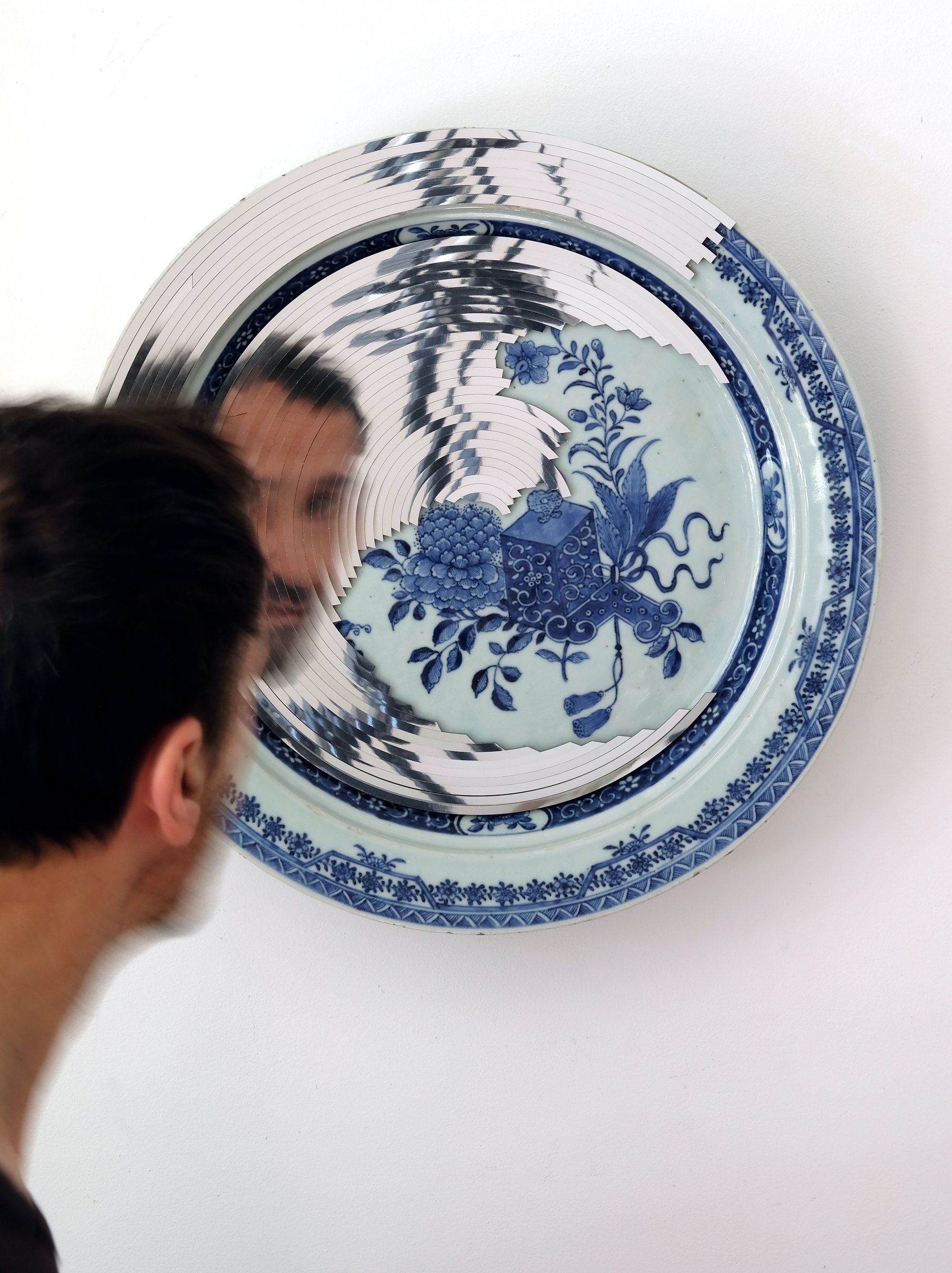 Viewer encountering a blue and white porcelain mirror work
